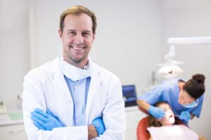 bigstock-Portrait-of-dentist-standing-w-187221421